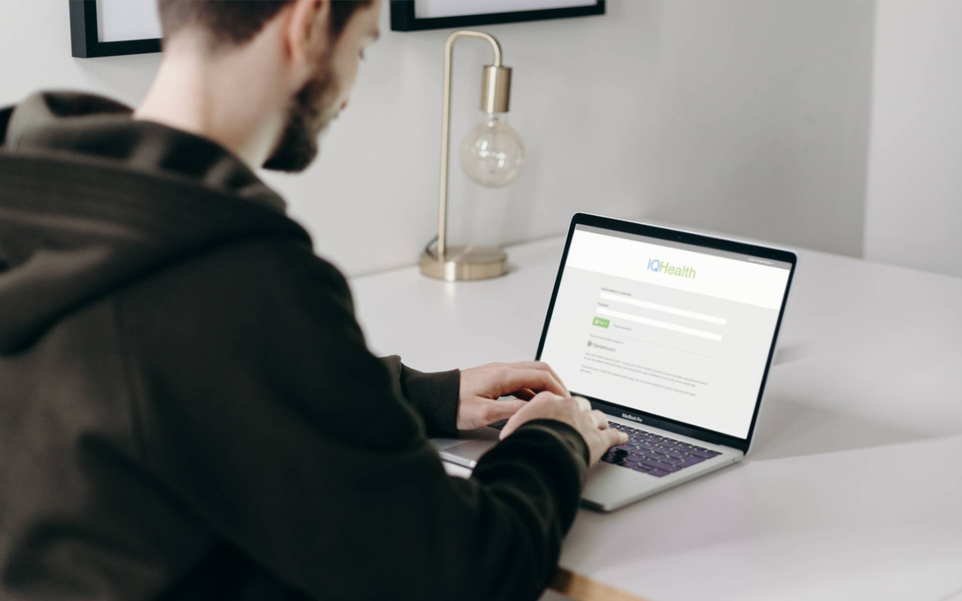 Man looking at patient portal on laptop