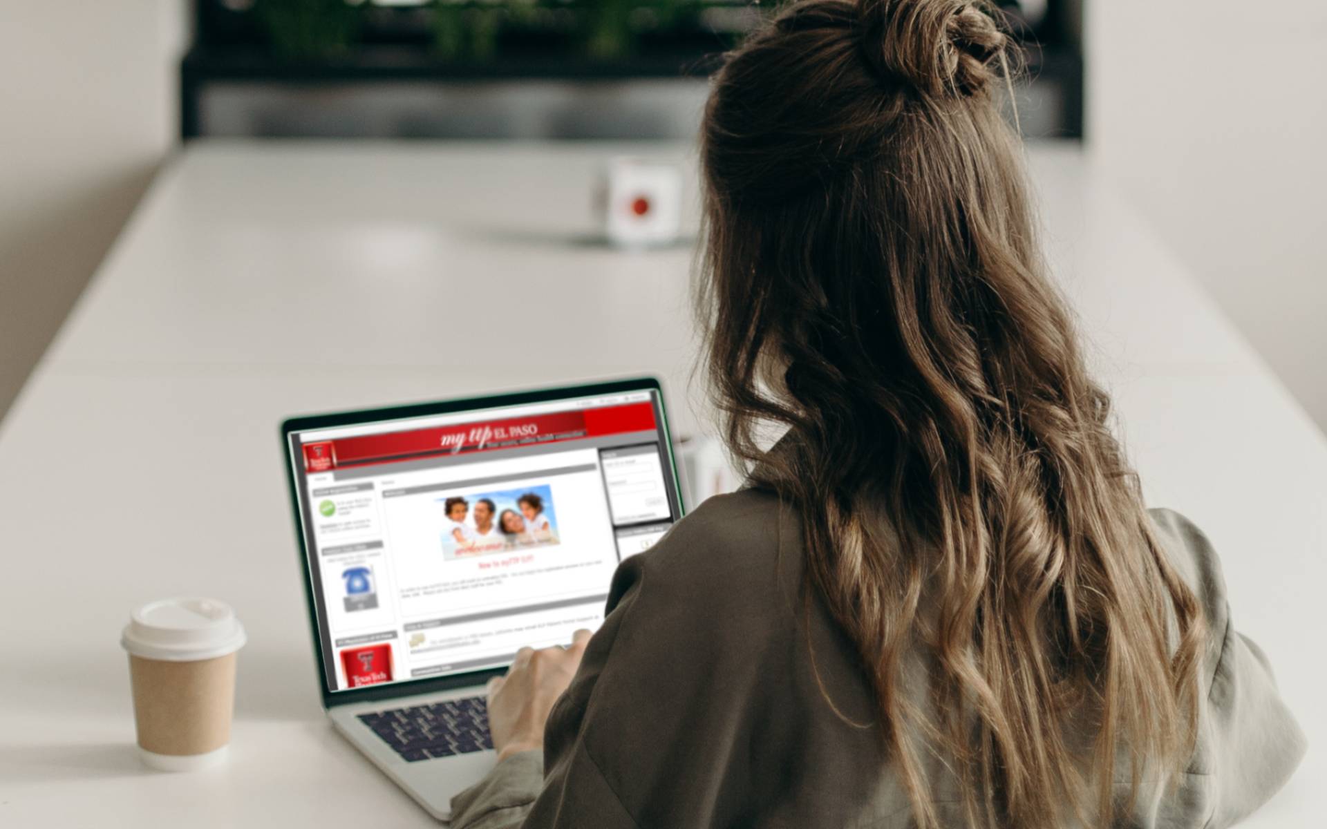 Woman looking at patient portal on a laptop